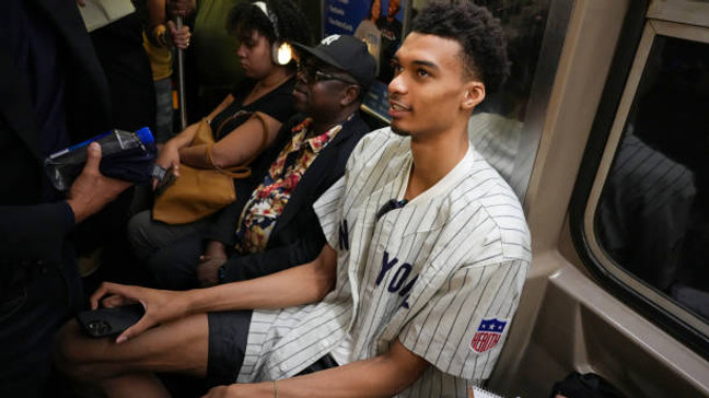 BRONX, NY - JUNE 20: Victor Wembanyama rides the subway to Yankee Stadium to throw out the first pitch on June 20, 2023 in the Bronx, New York. NOTE TO USER: User expressly acknowledges and agrees that, by downloading and or using this Photograph, user is consenting to the terms and conditions of the Getty Images License Agreement. Mandatory Copyright Notice: Copyright 2023 NBAE (Photo by Ryan Stetz/NBAE via Getty Images)